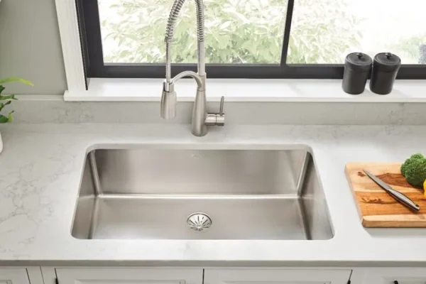 Granite platform with stainless steel sink and service platform.